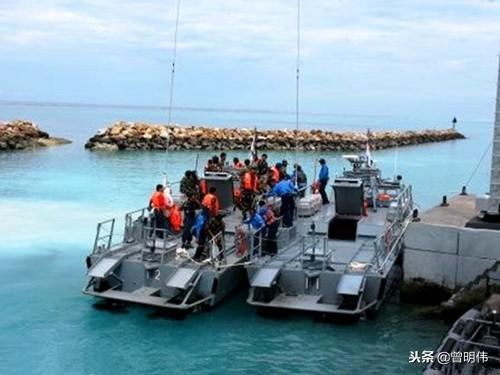 我国南沙领土光星仔礁，马来西亚填陆46亩，人工岛上建有炮兵阵地